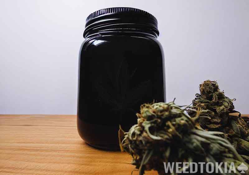 Black mason jar and weed