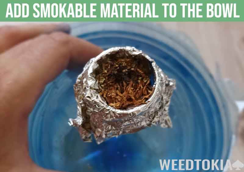 Add smokable material to the gravity bong