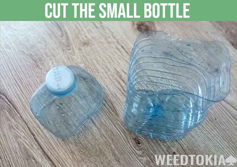 Cutting the small bottle of the Gravity Bong