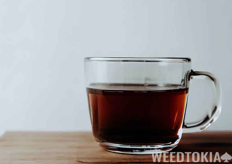 Glass of tea on table