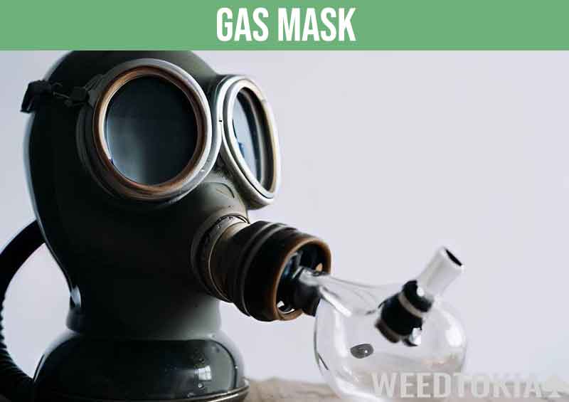 Gas mask with bong attached used to smoke marijuana